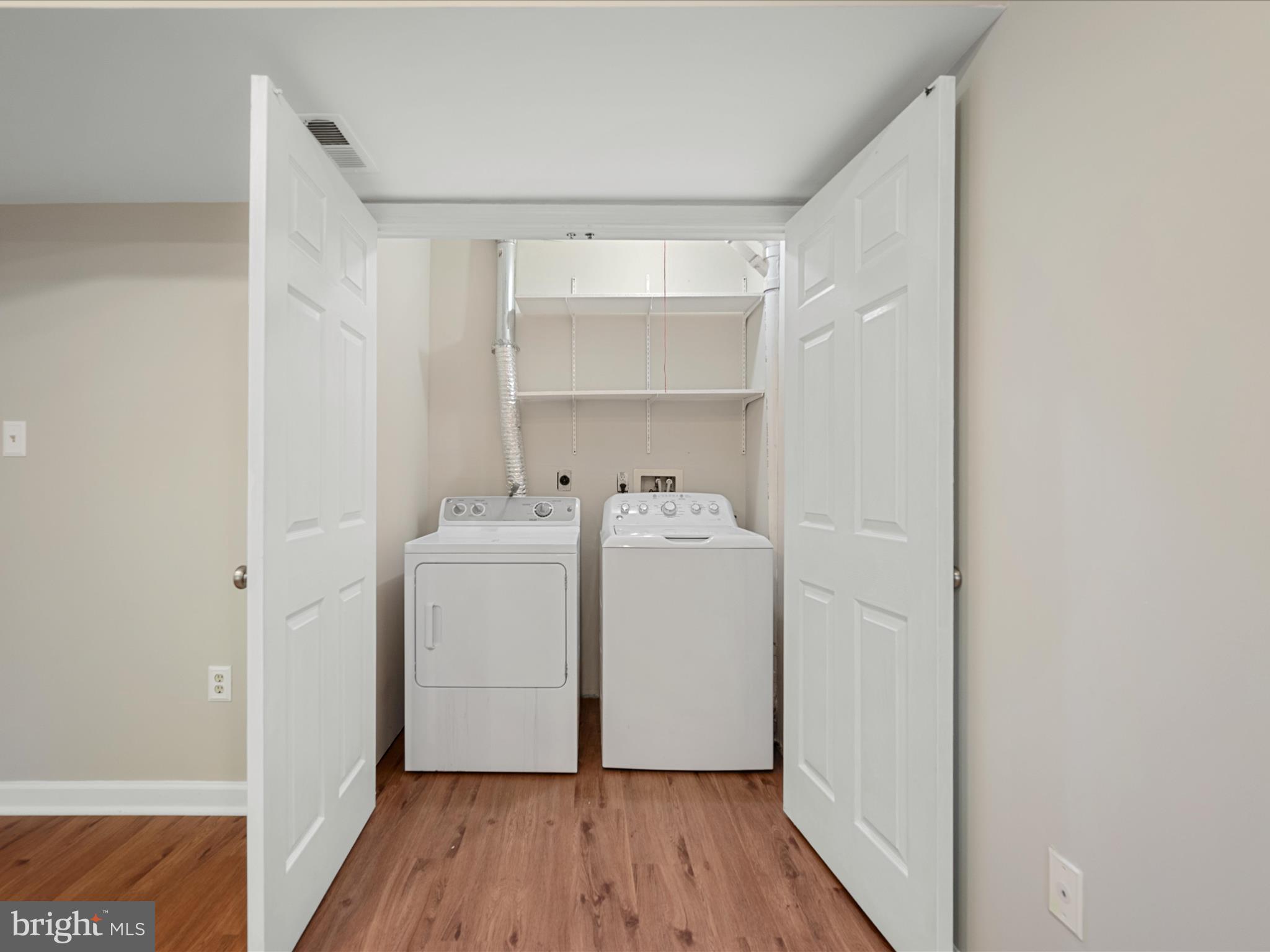 20760 Apollo Terrace Ashburn, VA 20147 - Photo 9 of 50 a utility room with wooden floor washer and dryer