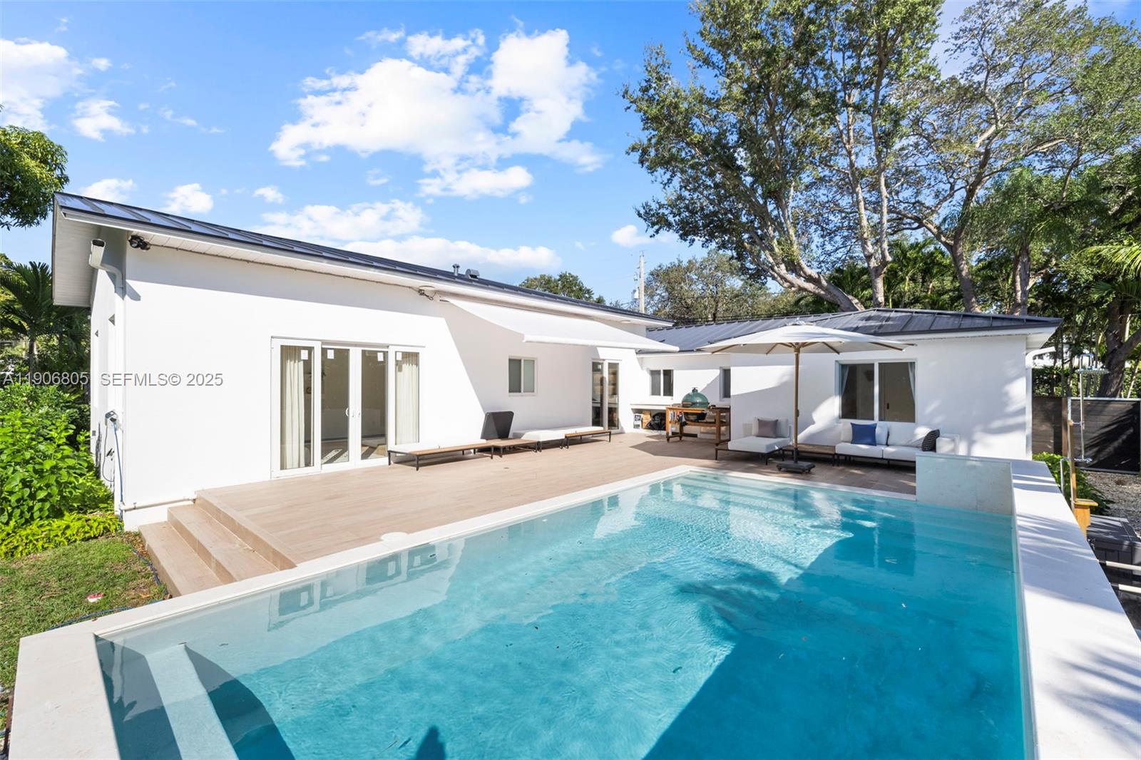 11370 Northeast 8th Avenue Biscayne Park, FL 33161 - Photo 1 of 48 New heated pool, deck, and canopy