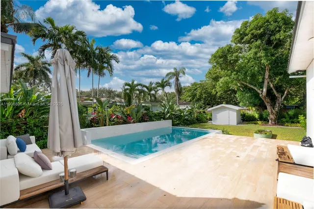a view of a patio with swimming pool