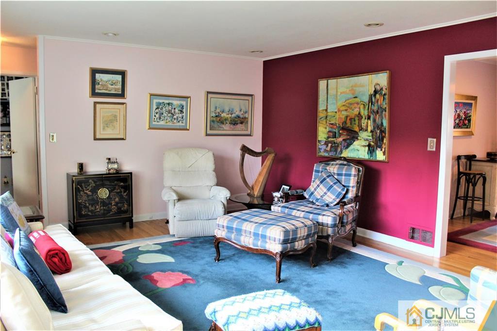 23 Clive Hills Road Edison, NJ 08820 - Photo 2 of 25 a bedroom with furniture and a couch