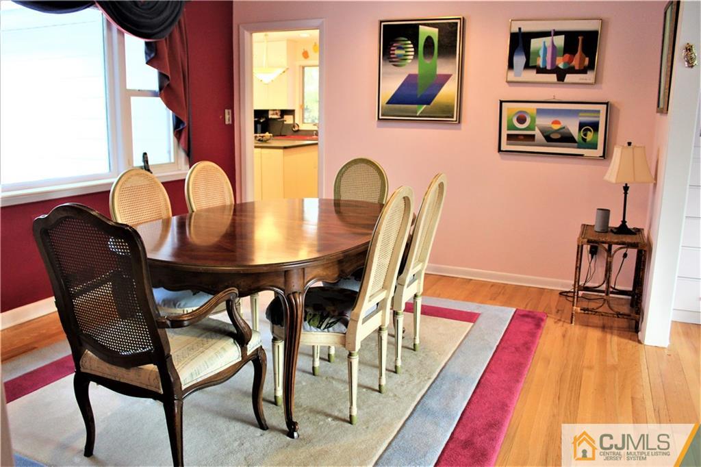 23 Clive Hills Road Edison, NJ 08820 - Photo 12 of 25 a view of a dining room with furniture and wooden floor
