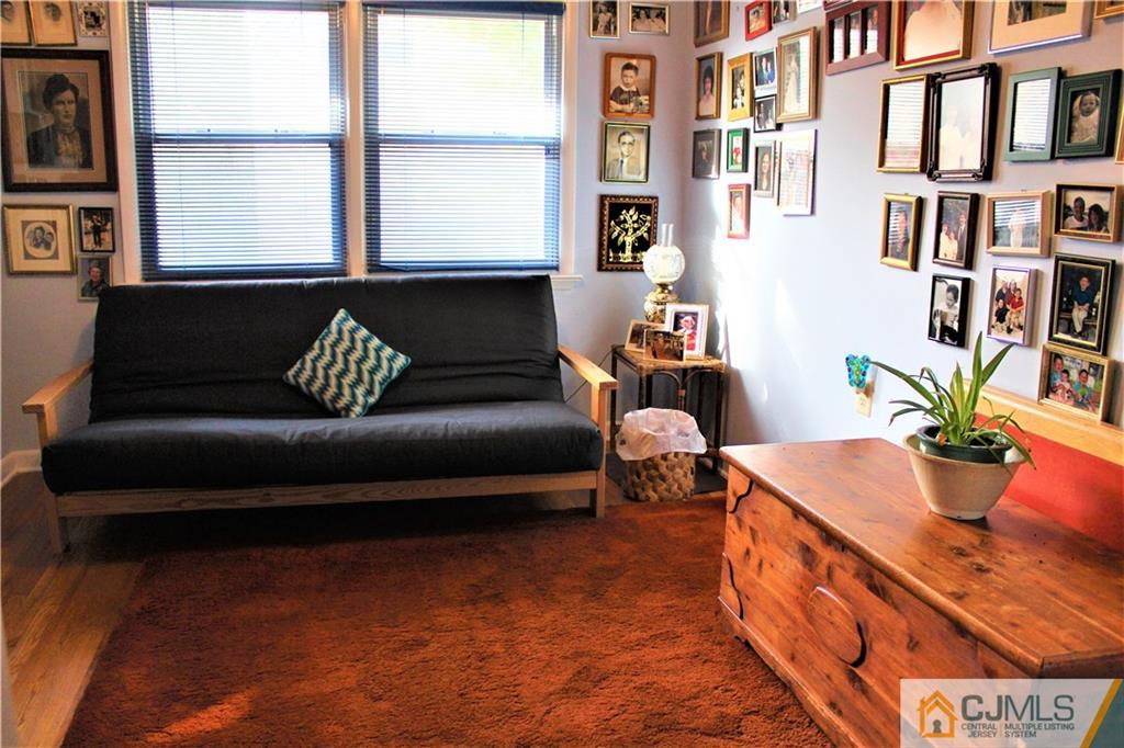23 Clive Hills Road Edison, NJ 08820 - Photo 18 of 25 a living room with furniture and a window