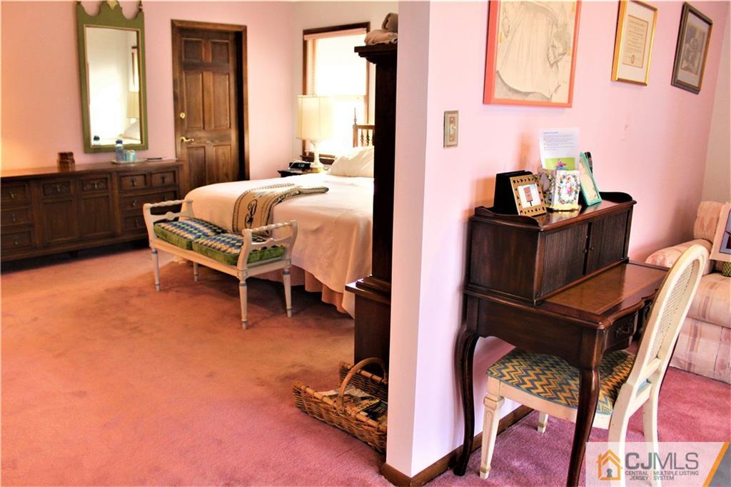 23 Clive Hills Road Edison, NJ 08820 - Photo 20 of 25 a bedroom with furniture and a window