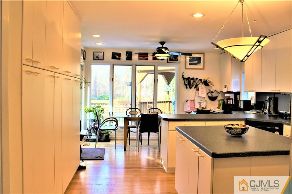 23 Clive Hills Road Edison, NJ 08820 - Photo 4 of 25 a dining room with furniture and wooden floor