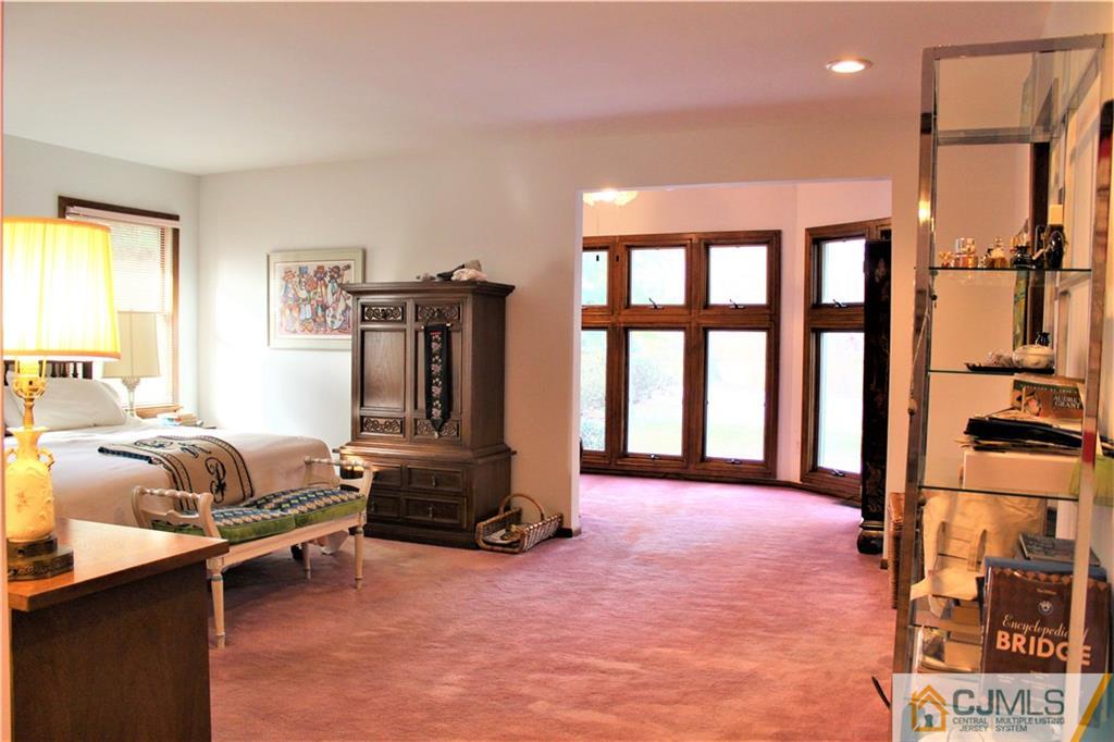 23 Clive Hills Road Edison, NJ 08820 - Photo 6 of 25 a bedroom with furniture and large window