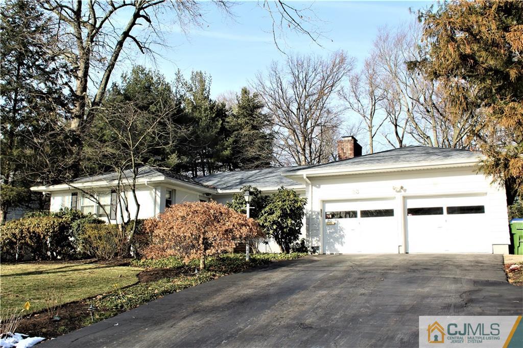 23 Clive Hills Road Edison, NJ 08820 - Photo 9 of 25 a view of a house with a yard and garage