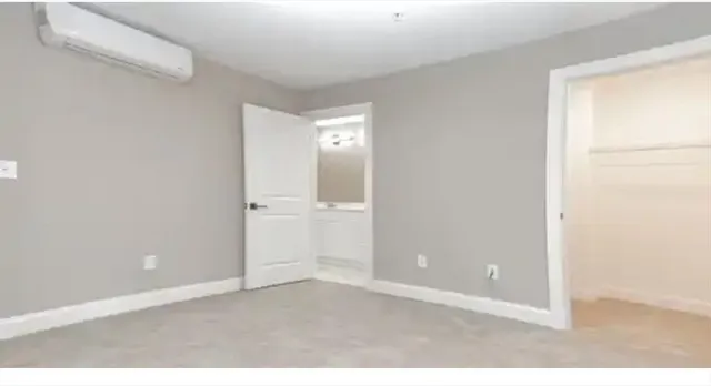 a bathroom with a bathtub and a sink