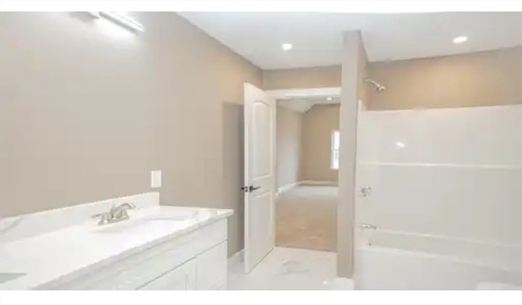 63 Progressive Street Worcester, MA 01604 - Photo 14 of 22 a bathroom with a bathtub and a sink