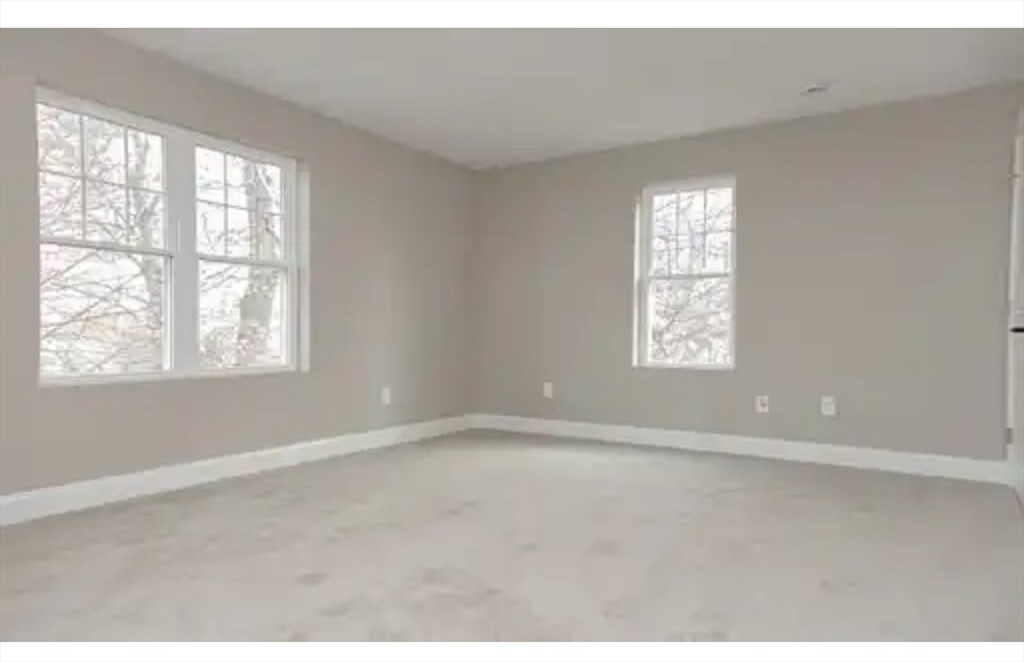 63 Progressive Street Worcester, MA 01604 - Photo 16 of 22 a view of an empty room with a window