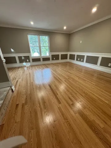 a view of an empty room with windows