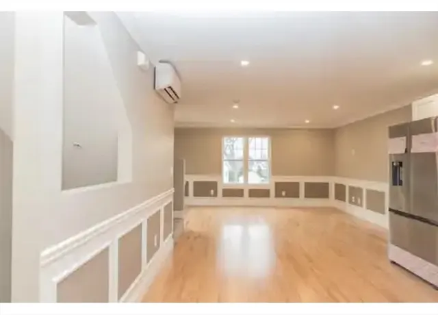 a view of a living room with a large window