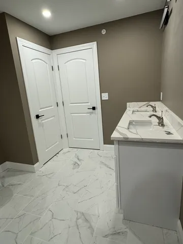 a utility room with a sink