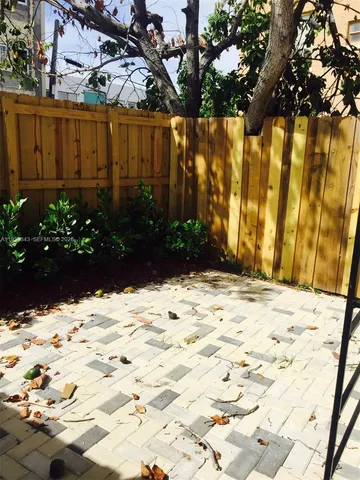 a view of a backyard of the house