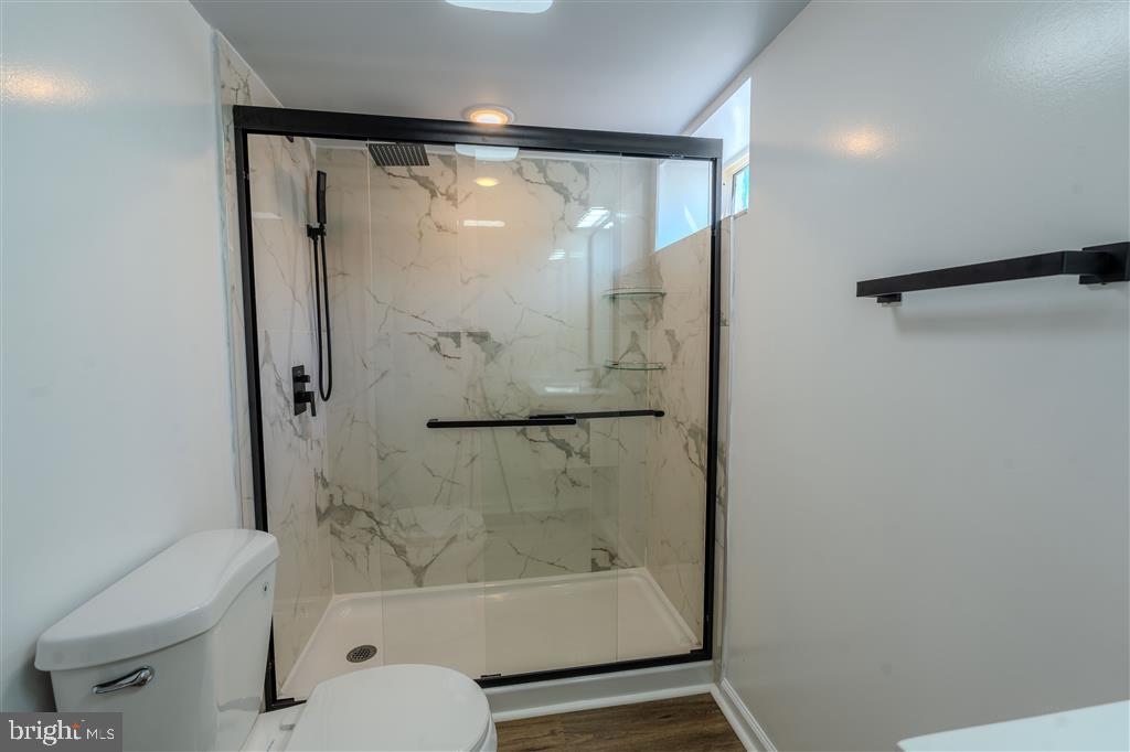 12324 Centerhill Street Silver Spring, MD 20902 - Photo 23 of 24 a bathroom with a shower and a toilet