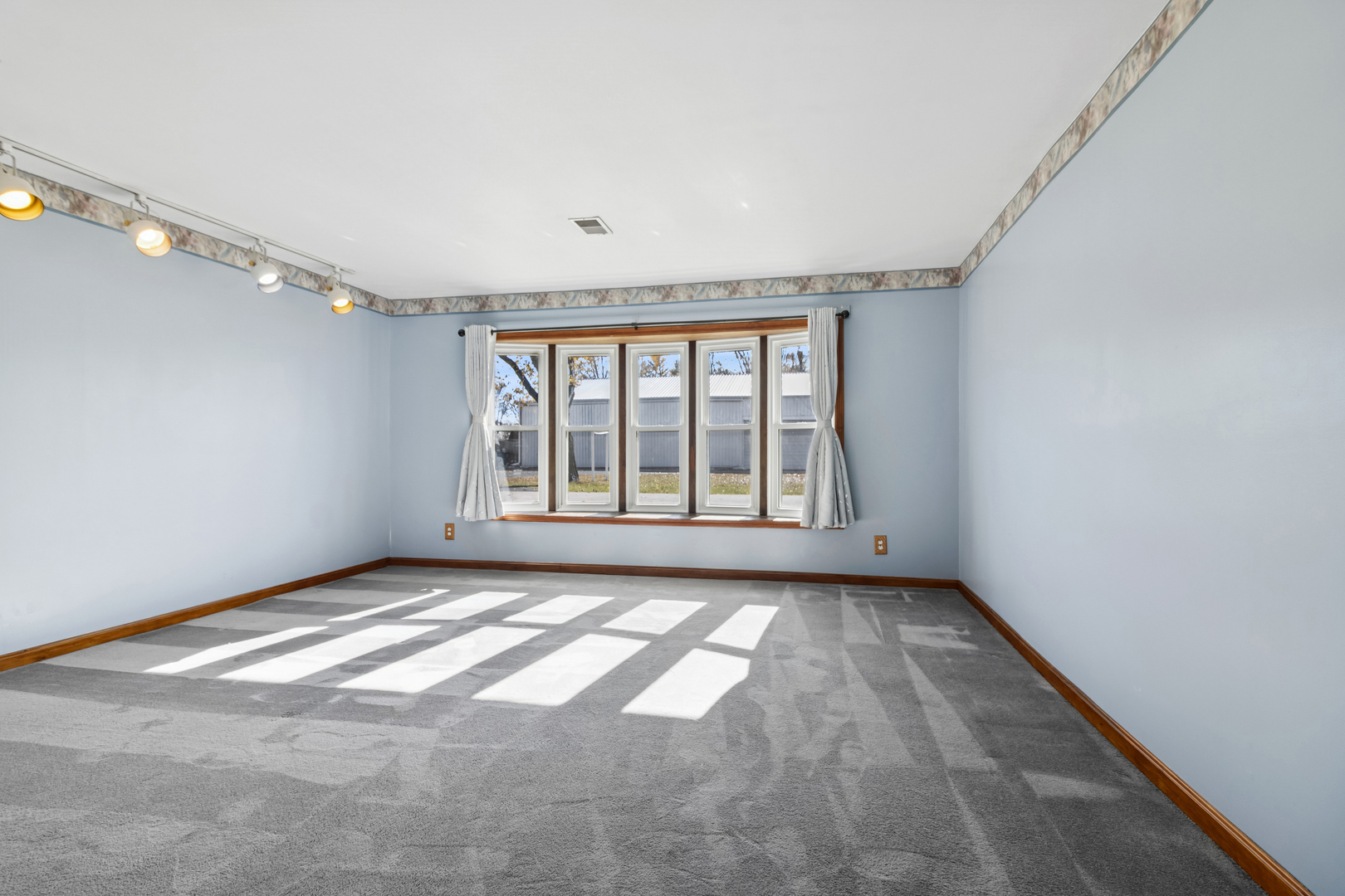 3030 South Berta Road Braceville, IL 60407 - Photo 12 of 24 a view of an empty room with a window