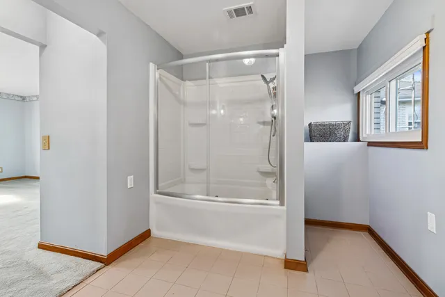 a view of a room with a painting on the wall