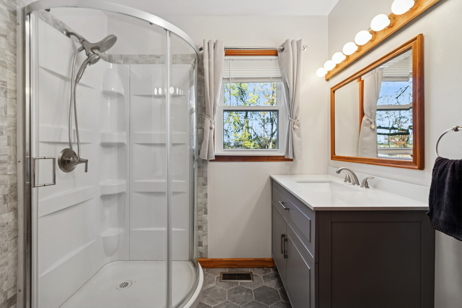 3030 South Berta Road Braceville, IL 60407 - Photo 19 of 24 a bathroom with a shower sink and mirror