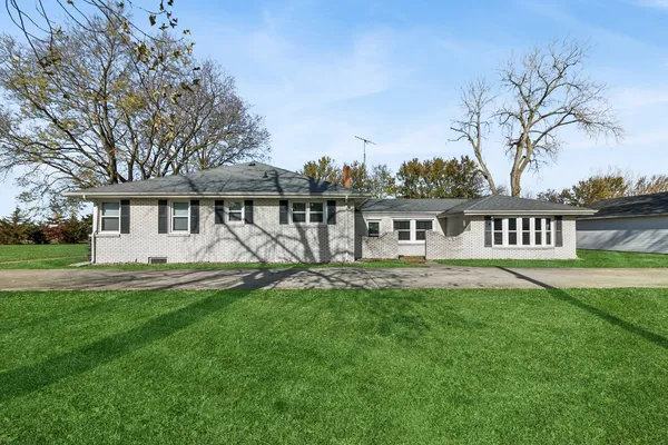 front view of a house with a yard