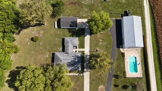 aerial view of a house with a yard