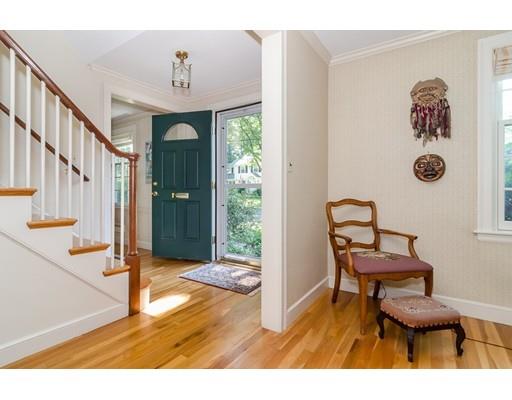 124 Pilgrim Road Wellesley, MA 02481 - Photo 3 of 21 a view of a hallway with wooden floor and workspace