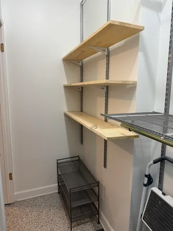 a kitchen with a stove top oven cabinets and stainless steel appliances