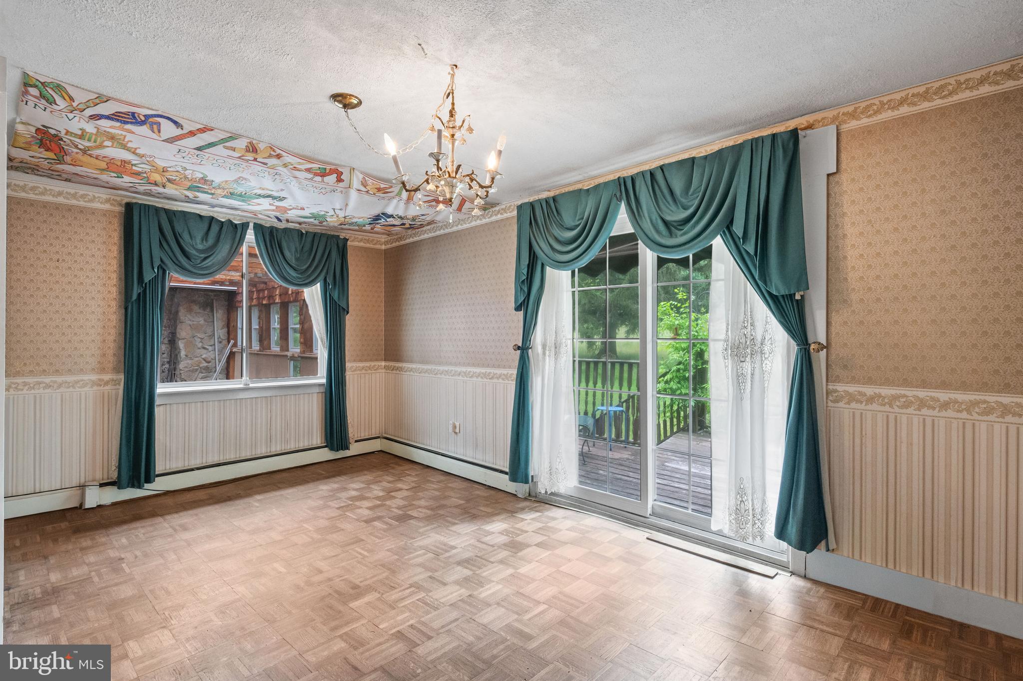 564 Blandon Road Fleetwood, PA 19522 - Photo 21 of 45 a view of a livingroom with a chandelier curtains and large windows