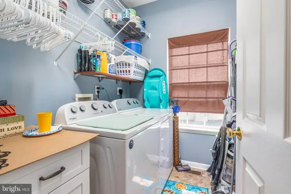 a bathroom with a sink double vanity and a mirror