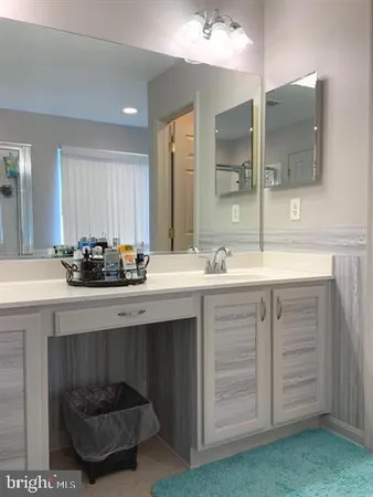 a bedroom with a bed dresser and a window