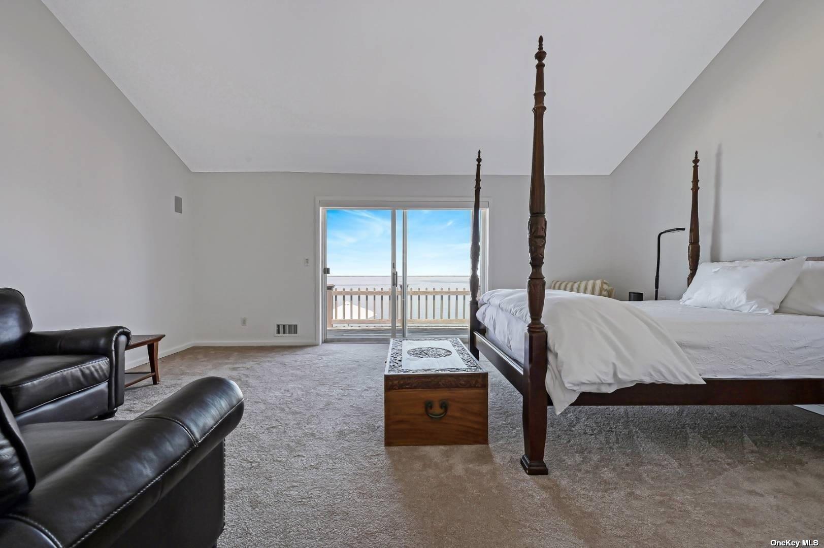 23 A Oakhurst Road Hampton Bays, NY 11946 - Photo 11 of 16 a bedroom with furniture and a window