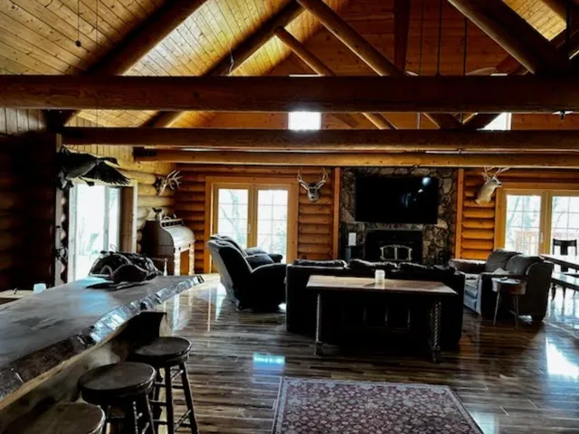 a large kitchen with a table and chairs