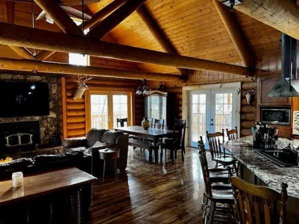a large kitchen with a table and chairs