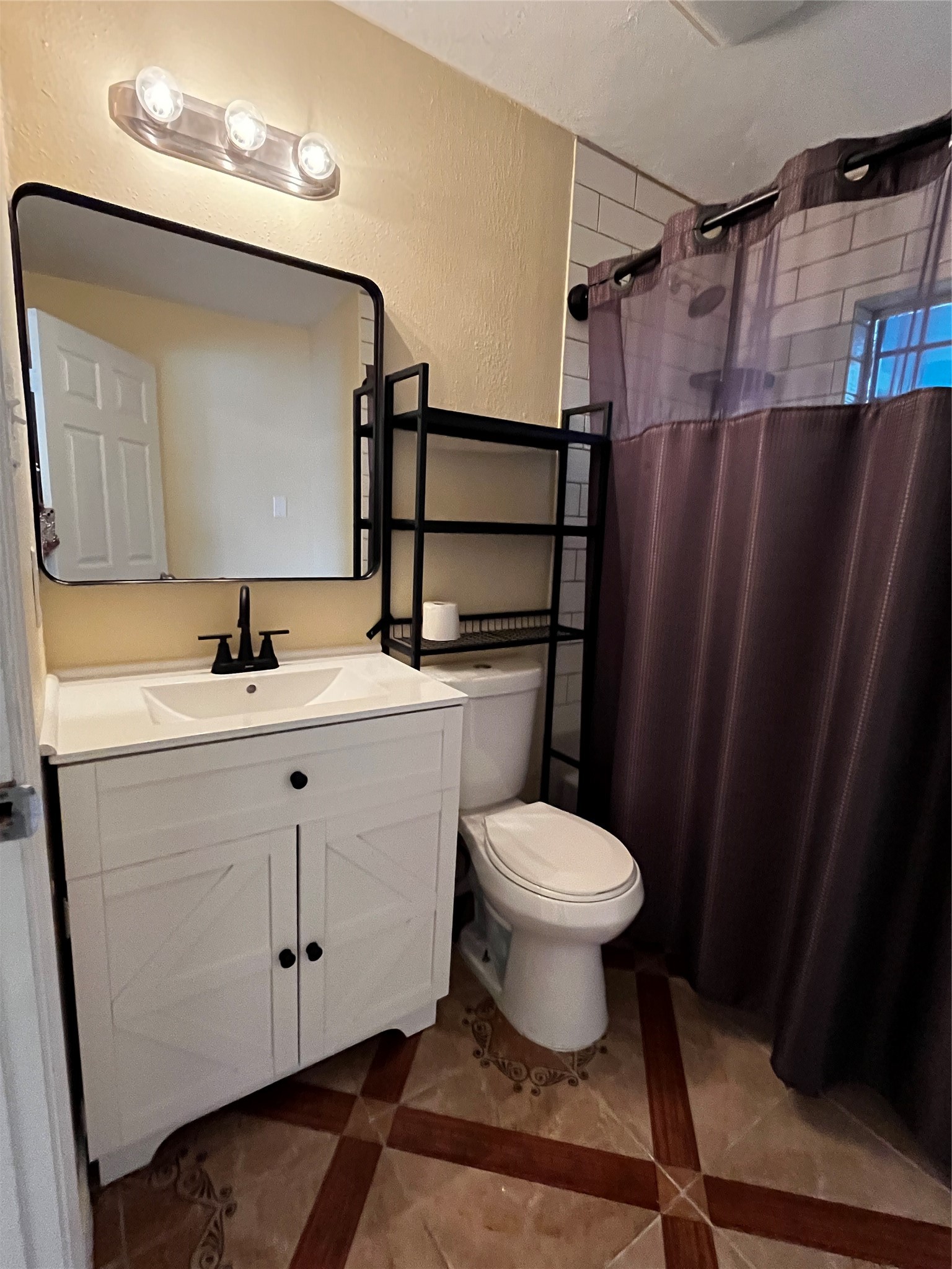 3163 Roe Drive Houston, TX 77087 - Photo 34 of 47 a bathroom with a sink toilet and shower
