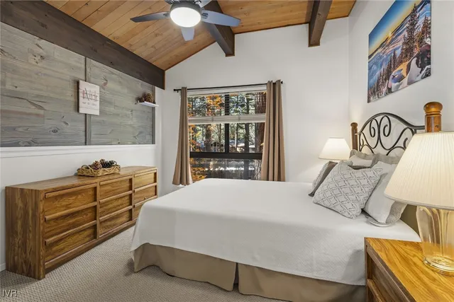 a bedroom with a bed and a dresser with the shoe rack