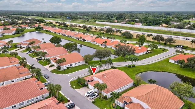 an aerial view of a houses with outdoor space