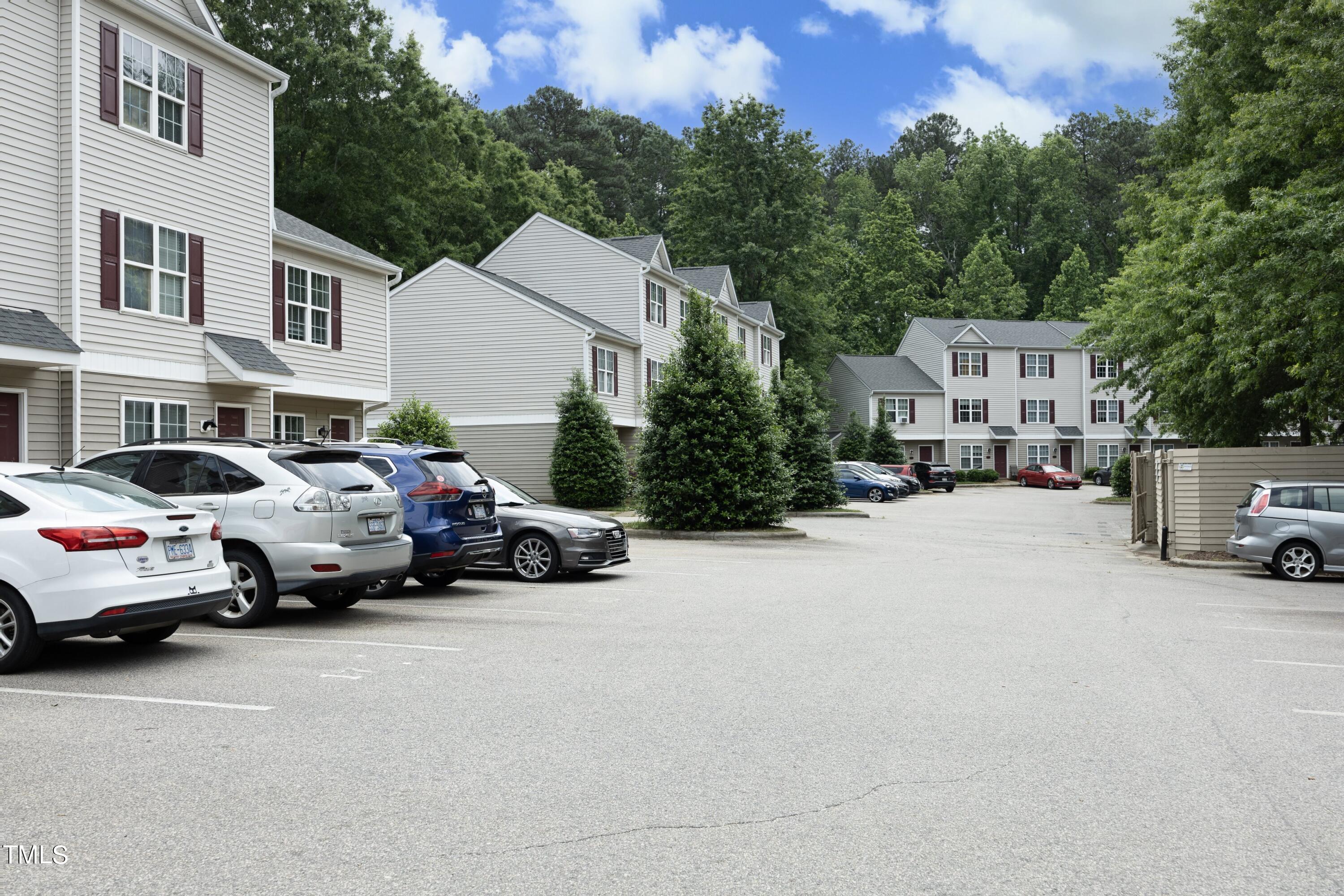 16 Red Lane Raleigh, NC 27606 - Photo 3 of 24 a view of a cars park in front of a building