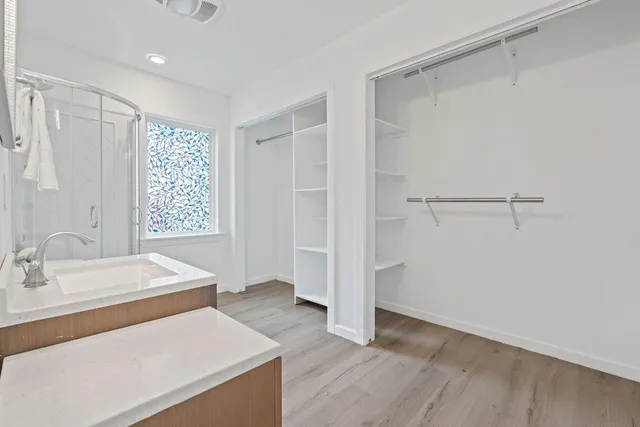 a room with a bed and a sink