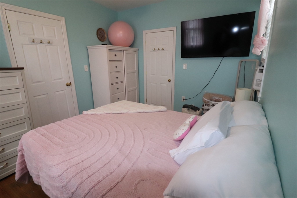 11 Palmer Street Fall River, MA 02724 - Photo 11 of 34 a bedroom with a bed and a flat screen tv