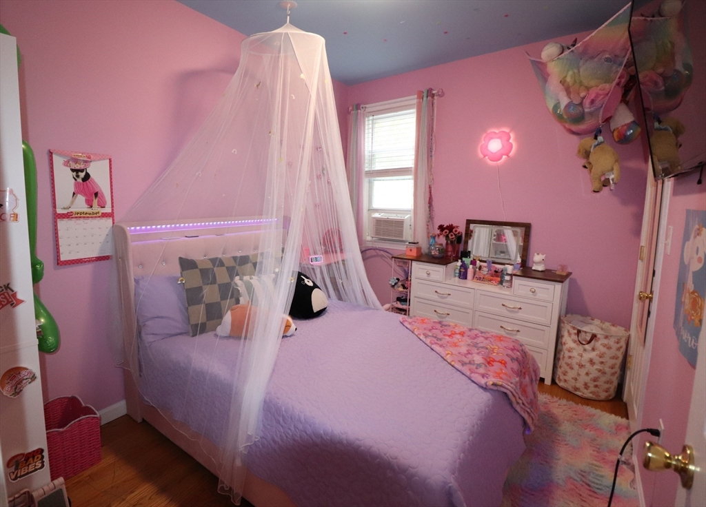 11 Palmer Street Fall River, MA 02724 - Photo 13 of 34 a bedroom with a bed dresser and a window