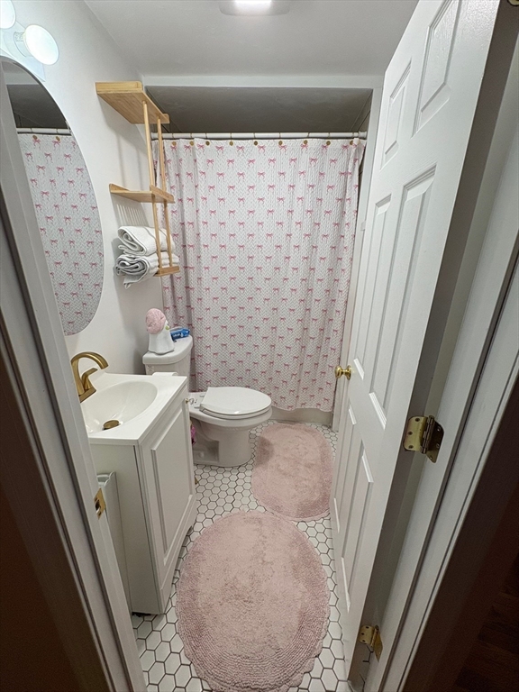 11 Palmer Street Fall River, MA 02724 - Photo 15 of 34 a bathroom with a sink toilet and shower