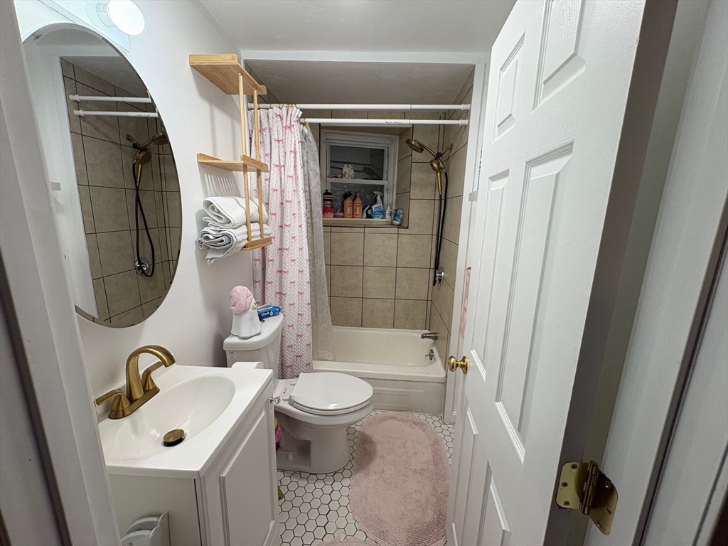 11 Palmer Street Fall River, MA 02724 - Photo 16 of 34 a bathroom with a sink toilet and shower