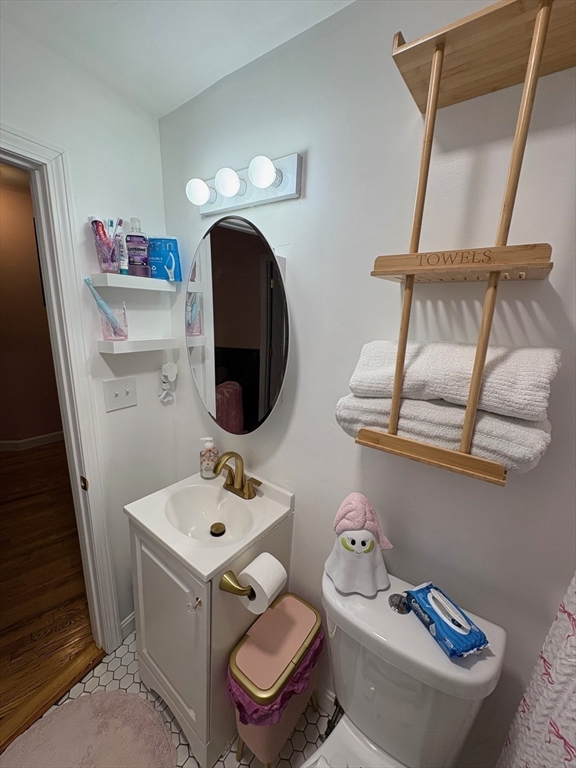 11 Palmer Street Fall River, MA 02724 - Photo 17 of 34 a bathroom with a sink mirror and toilet