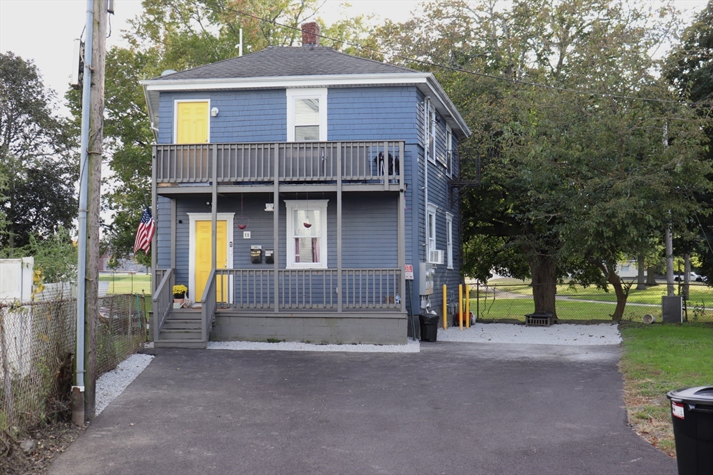 11 Palmer Street Fall River, MA 02724 - Photo 2 of 34 a view of a house with a small yard and large tree