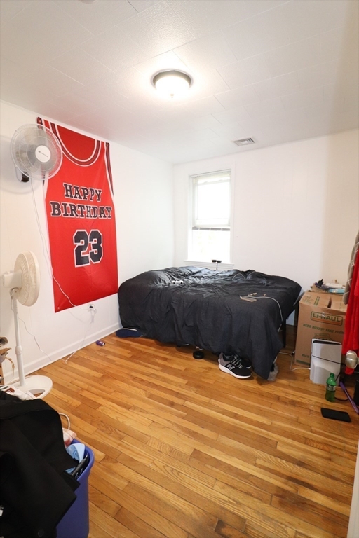 11 Palmer Street Fall River, MA 02724 - Photo 23 of 34 a bedroom with a bed and a lamp