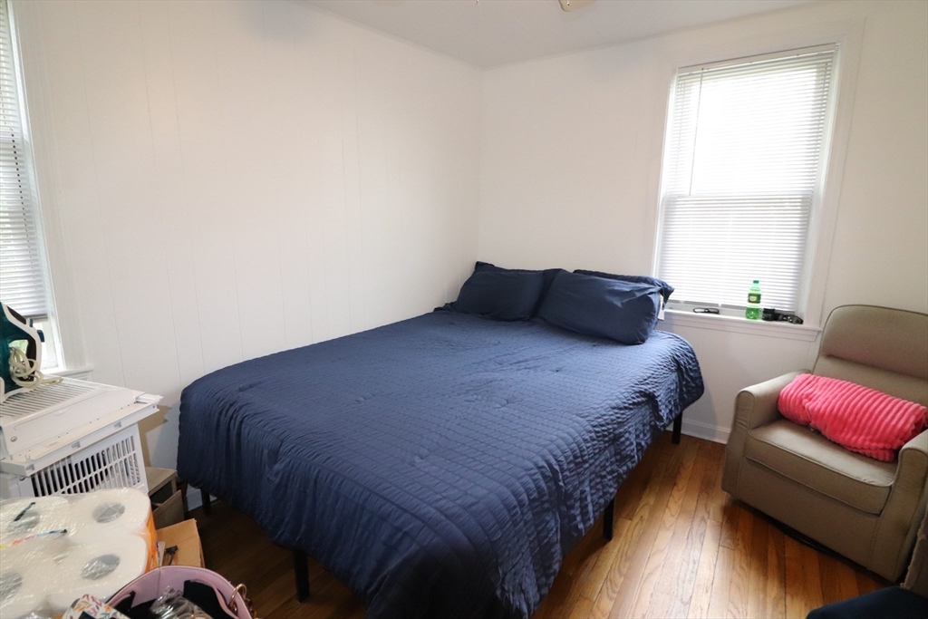 11 Palmer Street Fall River, MA 02724 - Photo 24 of 34 a bedroom with a bed and a couch