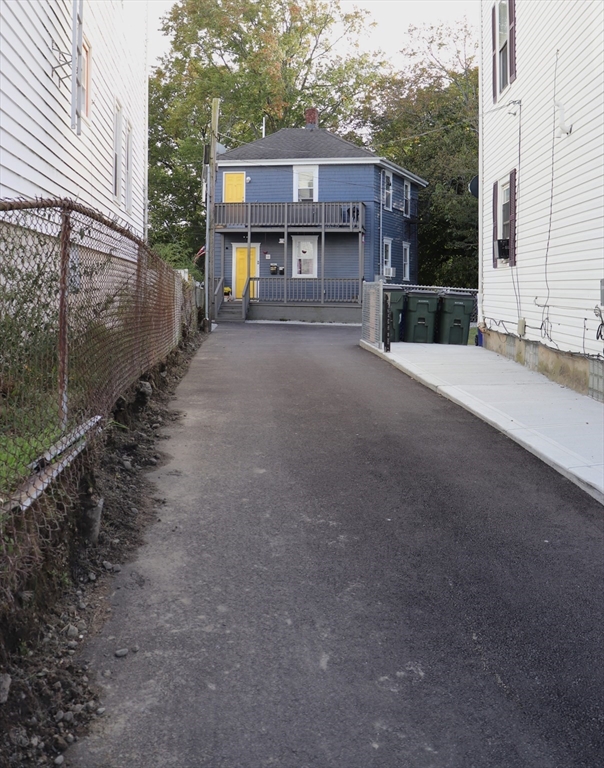 11 Palmer Street Fall River, MA 02724 - Photo 4 of 34 a view of a house with a backyard