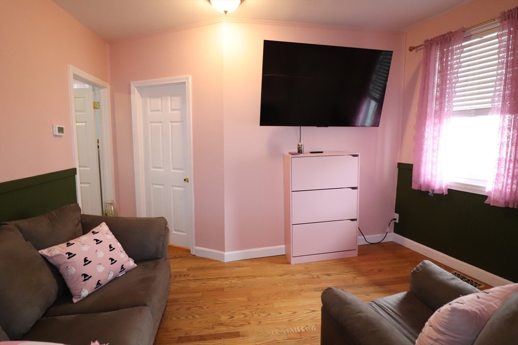 11 Palmer Street Fall River, MA 02724 - Photo 5 of 34 a living room with furniture and a flat screen tv