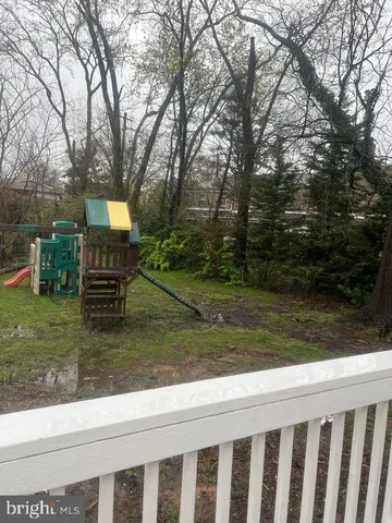 a view of a park with large trees