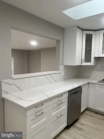 a view living room with granite countertop cabinets