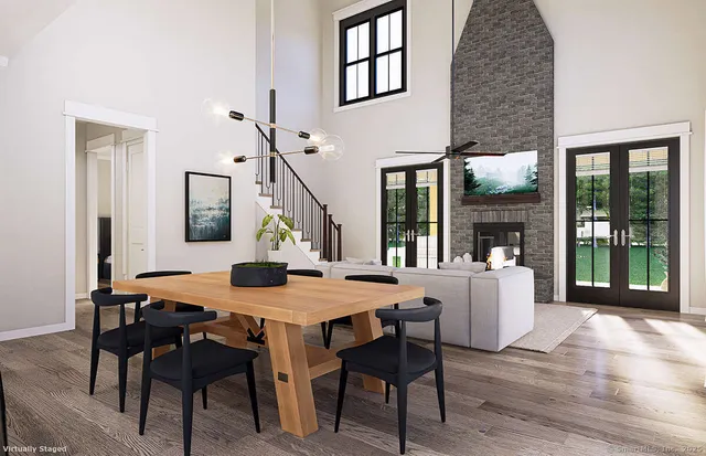 a kitchen with granite countertop a stove a sink dishwasher a refrigerator and a wooden cabinets