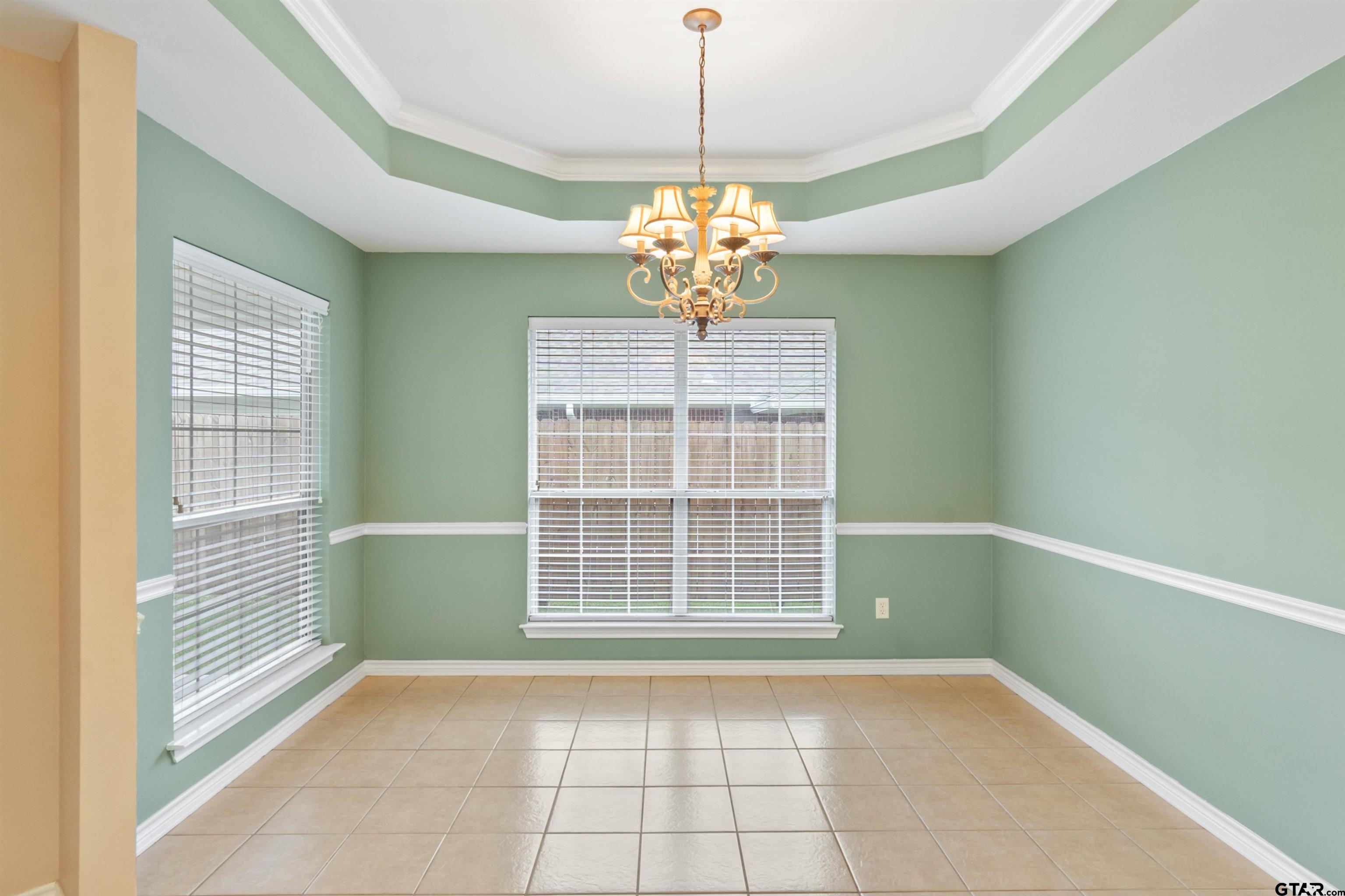 1521 Rice Road, Unit G102 Tyler, TX 75703 - Photo 11 of 23 a view of an empty room with a window